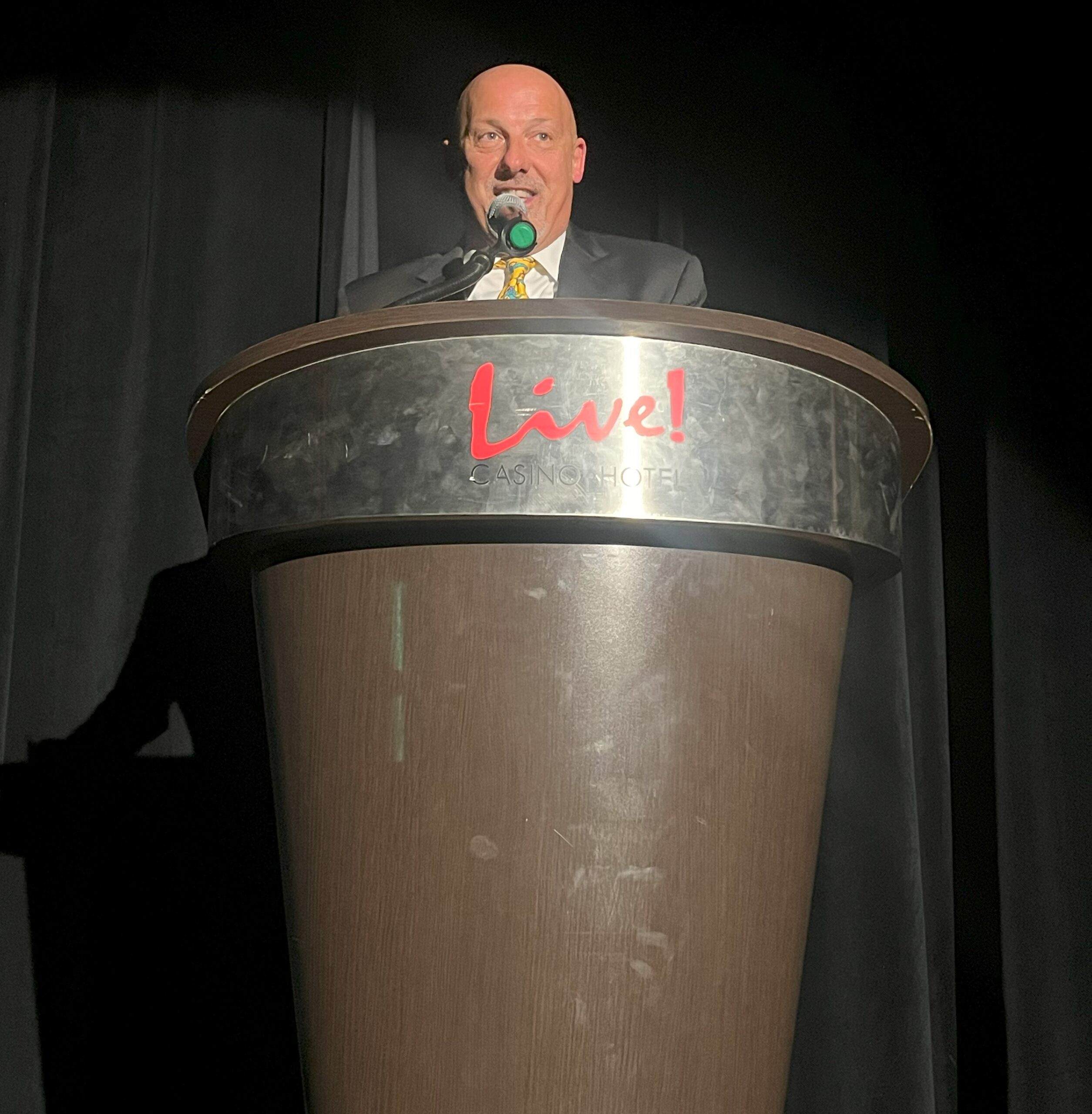 Chuck Schillaci giving a speech while accepting his award.